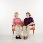 Women sitting laughing.