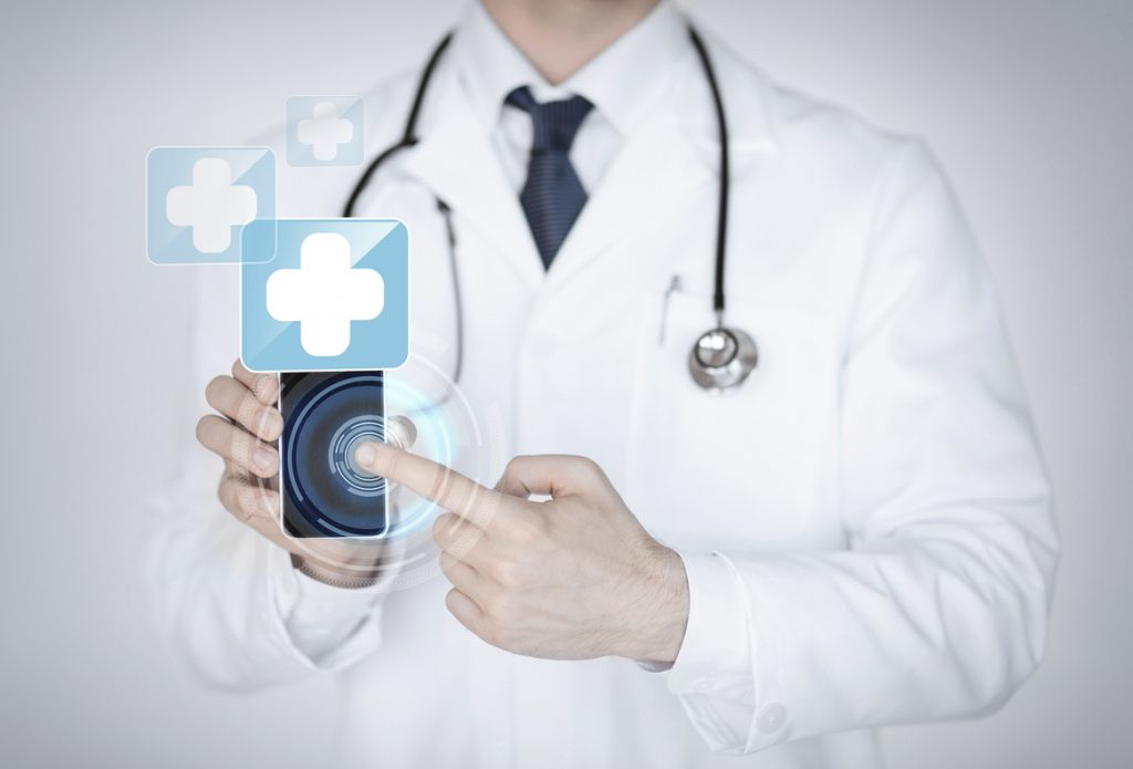 doctor holding smartphone with medical app